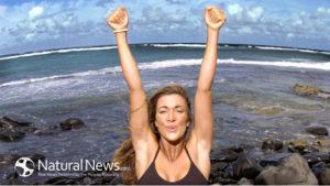 Woman-Victory-Fitness-Exercise-Ocean-Rocks-650X