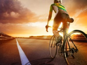 cyclist-riding-into-the-sunset