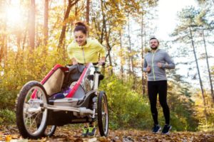 couple-running-with-stroller