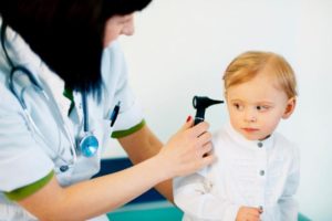 female-doctor-checking-child-s-ears