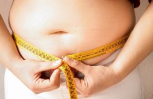 obese-teen-measuring-waist