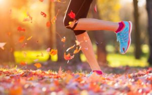 person-running-in-autumn-leaves